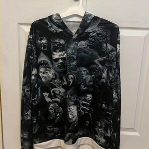 Patterned halloween villains hoodie with a white trim. Good condition